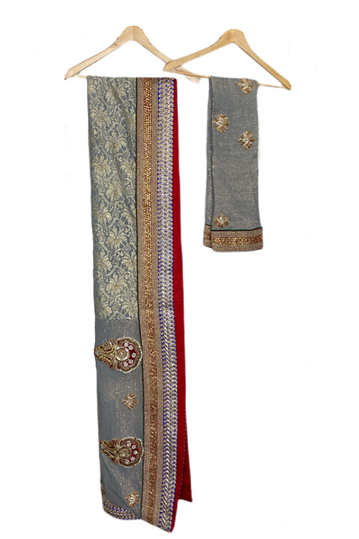 Saree: Gold & Stone Bute with Gold Stone Border. Shimmer Lace Pallu with Gold Stones Material: Shimmer Crushed Georgette Saree, Lace Pallu Colour: Grey Blouse: Unstitched - Gold & Stone Bute with Pearl & Stone Border. Material:  Shimmer Crushed Georgette  Colour: Grey