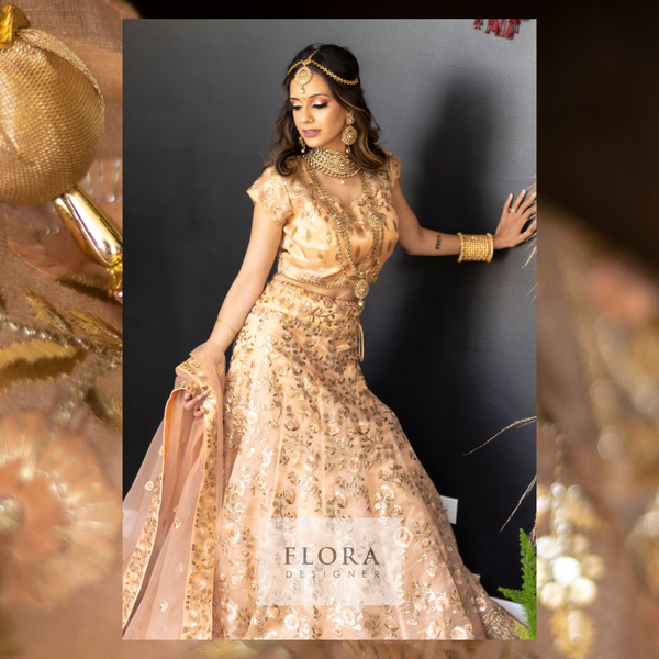 Peach Lengha on Organza Material with peach embroidered flowers and golden sequins. 