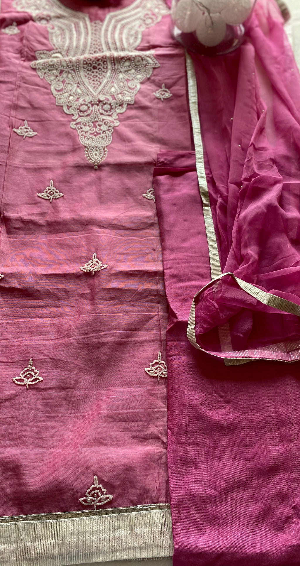 Unstitched Suit Material Shirt: Chanderi Silk with Pearl Bead Work Salwar: Chanderi Silk  Dupatta: Chiffon with Pearl work & Gota Border  Colour: Pink