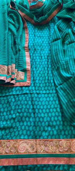 Shirt: Pure Fine Wool with Kashmiri Embroidery & Banarsi Silk Border Salwar: Pure Fine Wool Dupatta: Pure Georgette with Kashmiri Embroidery & Banarsi Silk Border  Colour: Teal